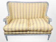 A French carved and painted two seater salon settee,
