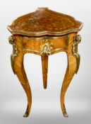 An early 20th century Continental Kingwood veneered and gilt metal mounted tripod jardinere stand