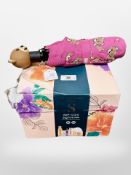 A Sanctuary Spa gift set together with a Moschino umbrella with tag.