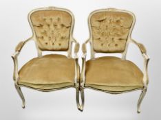 A pair of Continental painted and gilt salon armchairs