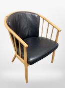 A Danish beech and black leather armchair