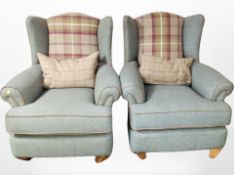 A pair of contemporary wing back armchairs