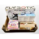 A box of new retail stock items - Clear pool cover, flying drone,