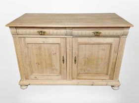 An early 20th century Continental pine sideboard,