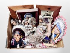 A box of Native American masks, busts, and pictures.