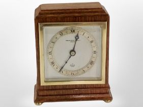 An oak cased mantel clock by Elliott, height 15.5cm.
