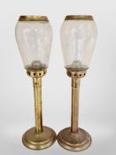 A pair of brass oil lamps with glass shades, height 40cm.