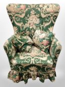 An early 20th century armchair in floral upholstery