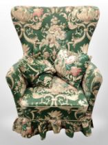 An early 20th century armchair in floral upholstery