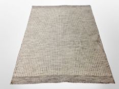 A 20th century machine made woolen rug,