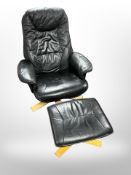 A black stitched leather armchair on beech support with matching footstool