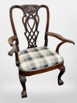 A 19th century mahogany armchair on claw and ball feet