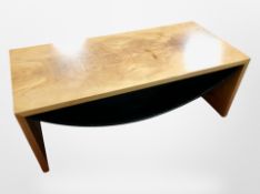 A Scandinavian walnut effect rectangular coffee table with curved under shelf