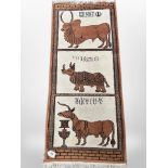 A North African pictorial rug depicting horned cattle and a rhinoceros,