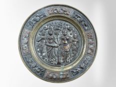 A 19th century Tibetan brass, copper and silvered metal plate,