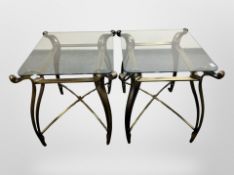 A pair of contemporary glass and metal lamp tables,