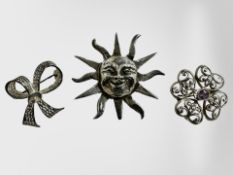 Three silver brooches.