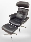 A late 20th century black stitched leather swivel manual reclining armchair and matching footstool