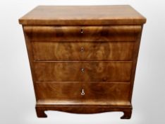A 19th century Danish figured walnut four drawer chest,