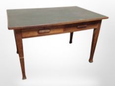 A 1930's oak library table fitted two drawers,