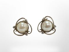 A pair of 18ct yellow gold pearl earrings set with diamonds. CONDITION REPORT: 3.7g.