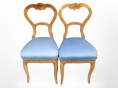 A pair of 19th century continental walnut balloon back chairs