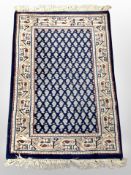 An Iranian rug on indigo ground,