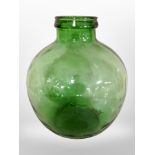 A green glass bulbous vessel, height 35cm.