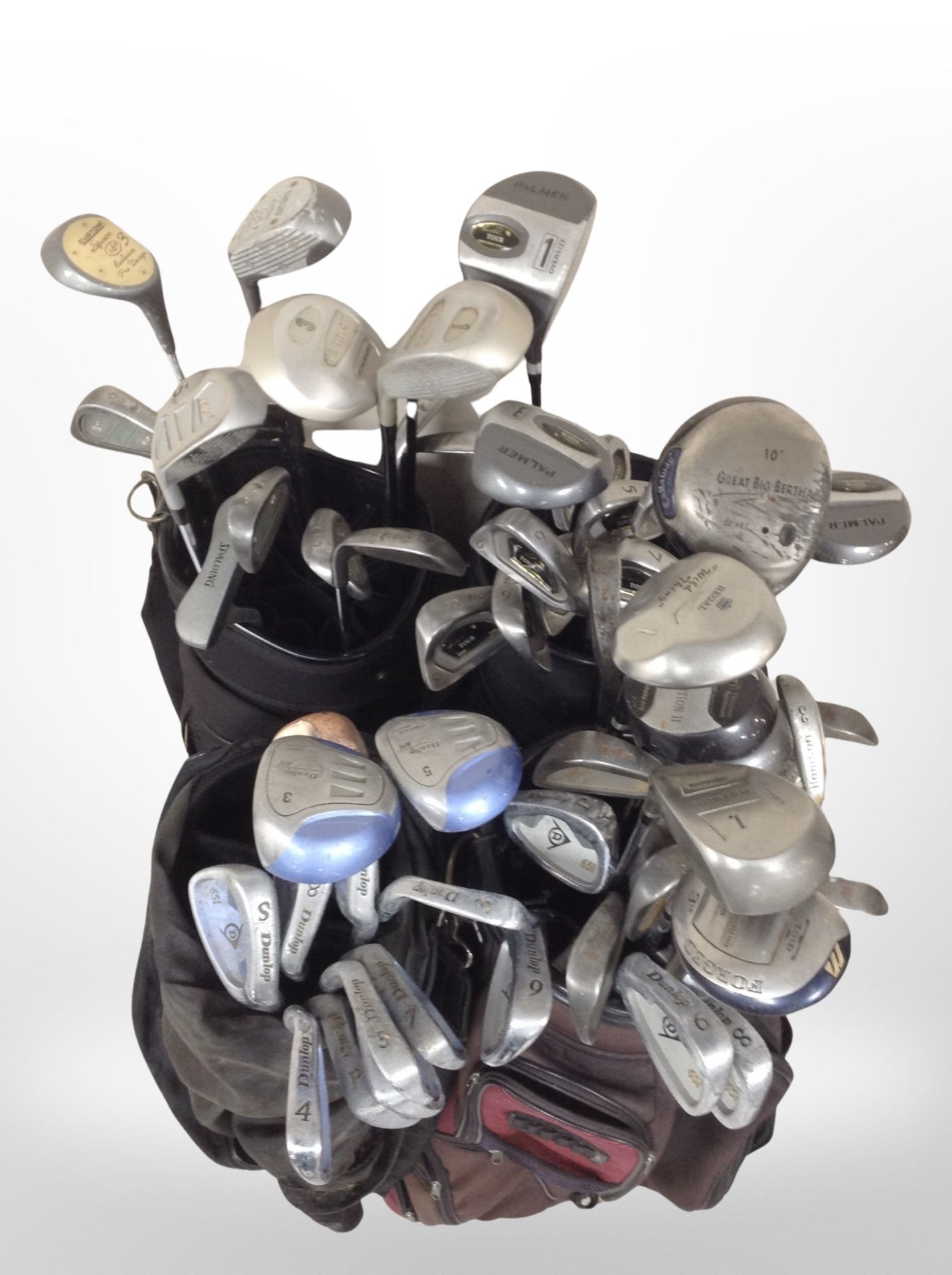 Several golf bags containing assorted drivers and irons including Dunlop, Palmer, - Image 2 of 2