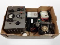 A box of electrical components including amperes tester, a vintage telephone.