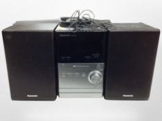 A Panasonic SA-PM24 digital audio player pair of speakers.