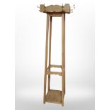 A pine hat and coat stand,