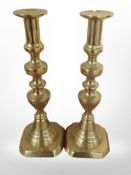 A pair of brass candlesticks, height 30cm.