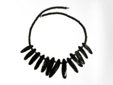 A black coral necklace, length 48 cm.