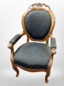 A 19th century continental carved walnut salon armchair in floral upholstery