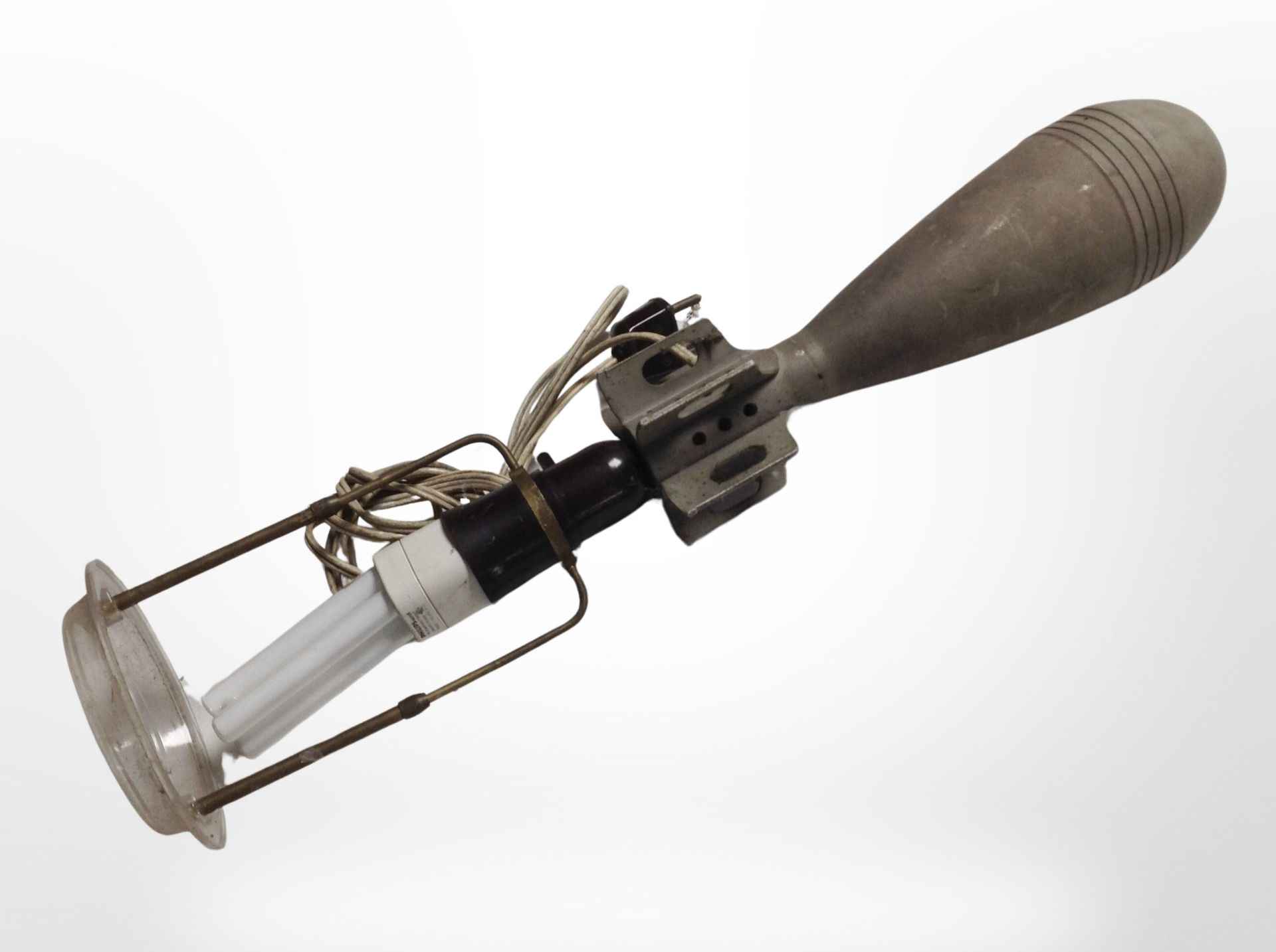 A continental table lamp manufactured from an inert mortar shell, height 49cm.