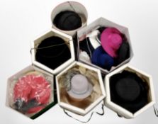 Several hat boxes containing a quantity of lady's formal dress hats.