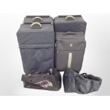 A group of luggage cases and holdalls