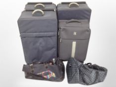 A group of luggage cases and holdalls