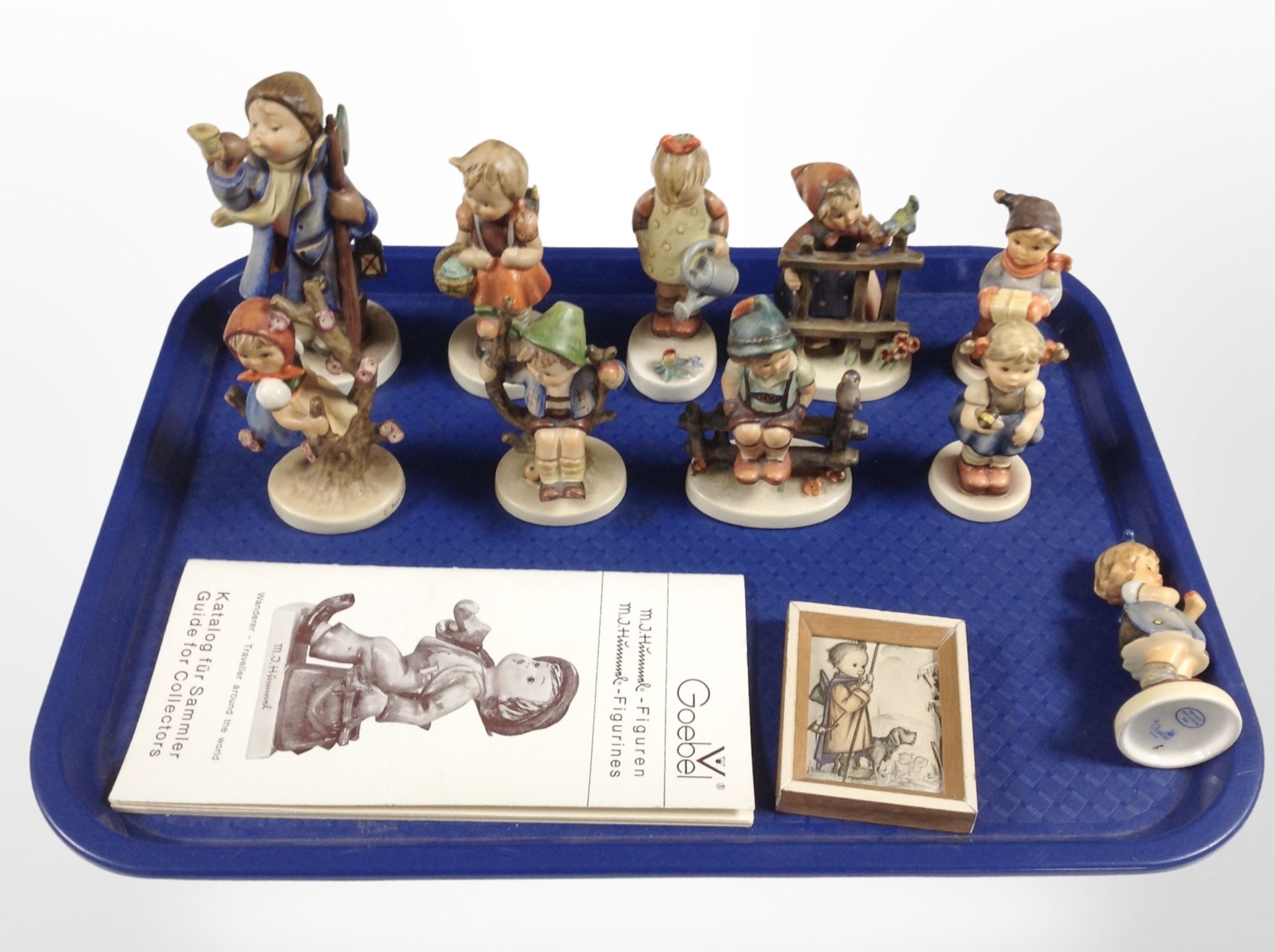 A group of Hummel figures.