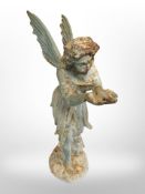 A patinated cast iron garden statue of an angel,