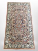 A machine made rug of Persian Saroukh design,