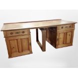 A 19th century oak and pine twin pedestal writing desk, with leather inset panel,