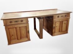 A 19th century oak and pine twin pedestal writing desk, with leather inset panel,