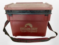 A Steade-Fast fishing box containing assorted fishing equipment including reels, line, lures, tools,
