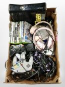 A box containing Xbox 360 console, assorted games, controllers, headphones, etc.