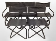 A set of five folding black metal director's style chairs with canvas sling seats
