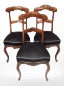Three 19th century continental walnut dining chairs