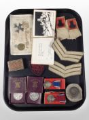A group of 1935 coronation medals, 1951 Festival of Britain coins, rank badges,