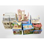 A group of Sylvanian Families models, some boxed.